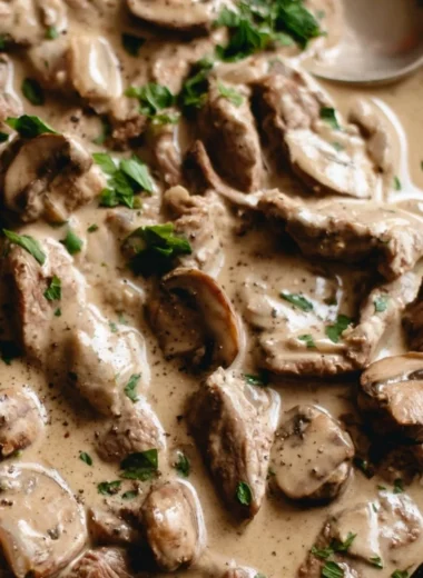 Cozy beef stroganoff served in a bowl with fresh parsley garnish