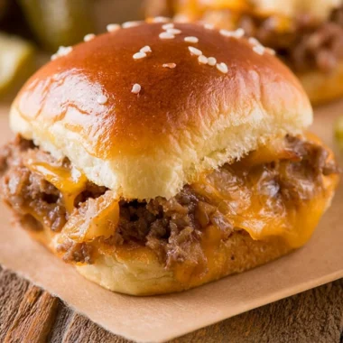 Delicious cozy cheeseburger sliders served on a wooden board.