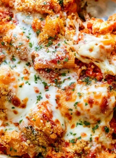 Cozy Chicken Parmesan Casserole topped with melted cheese and marinara sauce