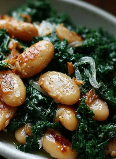 Pan-fried beans with kale served in a bowl, garnished and ready to eat.