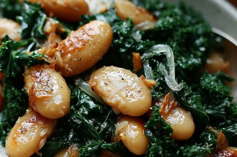Pan-fried beans with kale served in a bowl, garnished and ready to eat.
