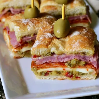 New Orleans style muffaletta sandwich bites served on a platter
