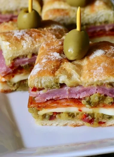 New Orleans style muffaletta sandwich bites served on a platter